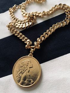 "⚜️NEW COLLECTION 2023⚜️ ✨EXPRESS SHIPPING OVER 100$ FREE Item Overview Handmade item Made to order. DETAILS High quality 2 micron 24k gold micron plating Lead Free and Nickel Free MEASURES Coin size: 40mm / thickness 4 mm Chain width- 7-8 mm GODDESS CURB NECKLACE Can goes along your favorite necklace you wearing daily for \" layered\" look or just by it self for \"clean\" and classy look. As a gift , will be beautiful for your best friend birthday, sister wedding, mom anniversary or your lovely Elegant Medallion Necklaces With Curb Chain, Elegant Medallion Curb Chain Necklaces, Elegant Medallion Necklace With Chunky Chain, Elegant Necklace With Chunky Chain And Medallion, Vintage Gold Medallion Necklace With Chain, Vintage Gold Coin Necklace With Chain, Vintage Figaro Chain Pendant Jewelry, Vintage Coin Necklace With Chain, Vintage Figaro Chain Necklace As Gift