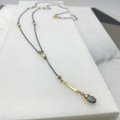 "This delicate Labradorite necklace is certain to catch everyone's eye. Delicate Labradorite beads and minimalist gold rings are interspersed on an airy gold chain. The subtle \"Y\" drop falls to the perfect point for your décolletage. Just so the back of your neck is not forgotten, we have added the lightest splash of color with two small beads finishing the closing clasp. Just the right touch for putting your hair up for a night of dancing. Total Length: 36 1/2\" Materials: Stones: Labradorite Handmade Minimalist Lariat Necklace As Gift, Minimalist Handmade Lariat Necklace As Gift, Handmade Minimalist Long Lariat Necklace, Handmade Minimalist Lariat Necklace, Minimalist Handmade Lariat Necklace For Gifts, Minimalist Handmade Long Lariat Necklace, Lariat Necklaces With Satellite Chain For Gifts, Minimalist Lariat Necklace With Satellite Chain, Minimalist Brass Necklace With Gemstone