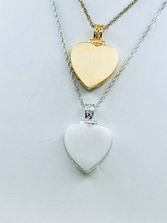 This beautiful heart pendant with satin finish is a unique way to hold a loved one's close with 2 compartments.  This pendant can hold a small amount of cremains, lock of hair, or dirt from the sacred burial grounds. This piece comes on an 18" matching chain, 3/4 inch size GOOD TO KNOW: ♥ Available in 14k plated gold or a Sterling Silver ♥THIS PENDANT CAN BE ENGRAVED-SEE PERSONALIZATION SECTION ♥Fill kit included with pendant PACKAGING: ♥The pendant comes in a small jewelry box that can easily b Keepsake Double Heart Charm Necklace, Double Heart Locket Necklace For Wedding, Wedding Double Heart Locket Necklace, Double Heart Locket Necklace With Heart Charm For Wedding, White Gold Heart Necklace With Charm For Keepsake, Double Heart Locket Necklace For Anniversary, Keepsake Double Heart Necklace With Heart Charm, Double Heart Charm Locket Necklace For Wedding, White Gold Double Heart Keepsake Necklace