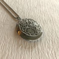 "Please note: If you need more than one, multiple quantities are available upon checkout. Timeless and classic, this gorgeous antiqued silver locket will become a special addition to your jewelry collection. Lightweight and beautiful with any neckline, dressed up or casual. The locket is 32mm in diameter, antique silver and opens for a secret place to keep pictures, messages, or whatever you like. The locket is plated brass and has a stainless steel rolo chain with a lobster clasp. You may choos Antique Silver Engraved Locket Necklace For Memorial, Engraved Antique Silver Locket Necklace For Memorial, Victorian Etched Locket Necklace For Gift, Victorian Etched Locket Necklace As Gift, Victorian Etched Locket Necklace Gift, Vintage Sterling Silver Engraved Locket Necklace, Vintage Engraved Sterling Silver Locket Necklace, Vintage Necklace With Engraving Option For Keepsake, Ornate Medallion Locket Necklace With Vintage Charm