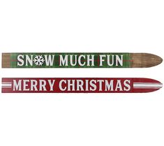 two wooden skis with snow much fun and merry christmas written on the bottom one