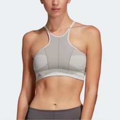 Super Edgy And Modern Sports Bra But Adidas For Stella Mccartney X Parley Primeknit. Super Sculptural Modern Art Design In Shades Of Grey With Lots Of Mesh. In Core White. I Really Love This Design!!! Adjustable Straps, Pull On Styling. Size Small. In Great Preowned Condition No Flaws Or Major Signs Of Wear Besides Slight “Crinkling” At Edges Of Iron On Logo On The Back (Please See Pic). I See This With Adidas All The Time Even When The Item Is In Like New Condition. Besides That, Looks Brand Ne Silver Fitted Activewear For Sports, Gray Sports Bra For Yoga, Silver Stretch Activewear For Athleisure, Fitted Athleisure Sports Bra With Strappy Design, Gray Activewear With Light Support, Fitted Silver Activewear For Sports, Silver Stretch Athleisure Activewear, Compressive Functional Sports Bra, Compressive Sporty Gray Sports Bra