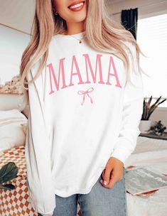 Embrace motherhood in style with the Coquette Mama long sleeve shirt- a perfect blend of comfort and coquettish charm, ideal for moms and expecting mothers. This girly mama crewneck, coupled with a coquette bow , makes an exquisite Mother's Day or baby shower gift, celebrating the journey of pregnancy with elegance. Shop now to gift the special mom in your life a touch of sweetness and warmth. 👕 PRODUCT INFO Made with 100% ring-spun cotton, these long-sleeve unisex shirts come packed with softn Mama Crewneck, Shirt Coquette, Bow Shirt, Bow Shirts, Coquette Bow, Pregnancy Gifts, Matching Shirts, Unisex Shirts, Baby Shower Gift