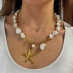 "Underwater Muse" necklace bridal edition  ⚜️super impressive summer Statement boho chic necklace .  This beautiful y lariat necklace  is made of pearly white irregular shape beads made of shells ( imitation pearls ) these beads are not fresh pearls but still made of natural elements known also as "shell pearl"   It is also decorated with a large gold plated 24k zamac star fish charm and a large freshpearl .  It easily closures at the front with a steel closure. Ideal Bohemia bridal jewelry.  It is a piece with a luxurious finish .  total length aprox 46 cm ( without the hanging part )  Star fish size aprox: 4.2 x 5 cm  it comes in two metal color tones . that means the metal details will be either in gold or silver tone . all rest parts remain the same  Nickel  free  🔆you may also check Gold Lariat Jewelry For Summer, Bohemian Baroque Pearl Jewelry As Gift, Bohemian Baroque Pearl Jewelry For Gift, Bohemian Baroque Pearl Jewelry Gift, Elegant Pearl White Jewelry For Beach, Pearl Dangle Lariat Necklace, Elegant White Shell Necklace For Summer, White Pearl Lariat Necklace With Clavicle Chain, Summer Lariat Necklace With Adjustable Chain