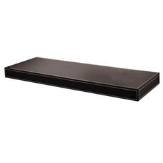 a black shelf that is on top of a white wall and has no one in it