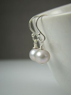 "Silver Pearl Earrings, Sterling Silver, Freshwater Pearls, Elegant, Classic by Shiny Little Blessings on Etsy. ★ This item is created with the highest quality sterling silver, NEVER plated! Best bet for all skin types and those with metal sensitivities. Your best choice for lasting quality. ★ Each pair of earrings comes individually gift wrapped and with a message card for convenient and loving gift giving. Let me know during check-out if you would like to add a personal message to the gift wra Pearl White Round Earrings For Everyday, Pearl White Drop Earrings For Everyday Wear, Everyday Pearl White Drop Earrings, Pearl White Dangle Earrings For Everyday, Simple White Nickel-free Earrings, Handmade Minimalist Pearl White Earrings, Handmade Pearl White Minimalist Earrings, Simple White Drop Earrings, Simple White Round Earrings