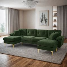 a large green couch sitting on top of a wooden floor next to a white rug