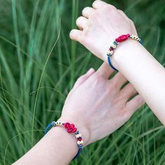 RED & BLUE ENCHANTING ROMANCE LUCKY KNOT BRACELET embodies the promise of the luck of peach blossom, signifying opportunities in love. White represents purity, while the golden threads signify preciousness, making the peach blossom knot a symbol of cherished and safeguarded love opportunities. This specific Lucky Knot is a typical Chinese decorative macrame knot, also called Ruyi Knot. Red, with the color of love and passion, combined with the knot type that symbolizes luck and fortune, the bracelet is a wearable good wish of smooth sailing and good fortune. Spiritual Blue Braided Bracelets As Gift, Spiritual Blue Braided Bracelet As Gift, Spiritual Blue Braided Bracelets For Gift, Handmade Adjustable Friendship Bracelets For Promise, Adjustable Handmade Friendship Bracelets For Promise, Hand Wrapped Braided Bracelets As Gift, Hand Wrapped Braided Bracelet For Gift, Blue Braided Bracelets As Gift, Handmade Good Luck Bracelets