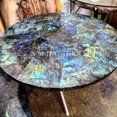 a table that has some kind of blue and black marble on it, with the words stonecraft galary