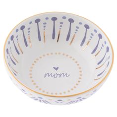 a white bowl with blue and yellow designs on the rim that says mom in front of it