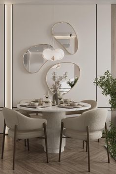 an elegant dining room with white chairs and round marble table surrounded by circular mirrors on the wall