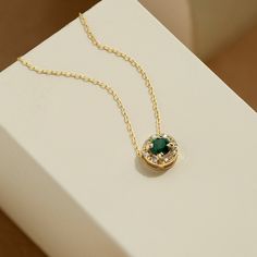 "1- P R O D U C T ∙  D E S C R I P T I O N The green color of the emerald stone symbolizes good fortune, youth, and rebirth. With our Diamond Emerald Necklace, you can help share the right vibe that you have in your heart. 2- P R O D U C T ∙  D E T A I L S Diamond Quality: * Diamond carat: 0.01 ct. * Clarity: VS2 * Color: F-G * Cut: Excellent cut  *Setting Type: Prong Setting Emerald carat: 0.3 ctw Gold material: 14K solid gold Choice of gold color: Yellow gold, Rose gold, White gold Choice of c Dainty Green Diamond Necklaces, Elegant Gold Plated Round Birthstone Necklace, Fine Jewelry Green Diamond Necklace, Green Diamond Necklace Fine Jewelry, Elegant Gold Emerald Necklace With Round Pendant, Green Round Necklace Gift For Her, Gold Plated Round Emerald Necklace, Round Green Emerald Gold-plated Necklace, Round Gold Plated Emerald Gemstone Necklace