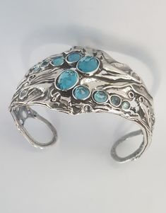 "From Porans collection ----> Unique Silver Cuff bracelet with10 MOP(shells) inlaid. Flexible and can fit any wrist. Dimensions: Max Width: 39 mm\\ 1.56 inches Available with Many other stones! This bracelet will look beautiful with these necklaces: https://www.etsy.com/il-en/listing/206844129/sterling-silver-necklacesstatement?ref=listings_manager_grid https://www.etsy.com/il-en/listing/117386677/sterling-silver-big-gemstone?ref=listings_manager_grid An amazing gift for yourself or loved one Boho Bangle, Wide Cuff Bracelets, Sterling Silver Bangle, Turquoise Bracelet Cuff, Sterling Silver Cuff Bracelet, Bracelet Vintage, Bracelet Sterling Silver, Wide Cuff, Sterling Silver Bangles