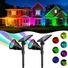 three solar powered garden lights in front of a house with multicolored lights on it