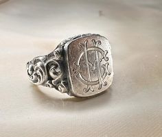 Massive 1920s antique silver German signet ring, with initials 'CH' or 'HC' engraved, marked '900' for silver, the ring is in good condition. Box on the photos not included! Material: 900 silver  Weight: 11.8 g US size: 10 1/2 (EU 63 1/2) Box on photos is NOT included! Ring With Initials, Silver Signet Ring, Us Size 10, German Silver, Slovenia, Signet Ring, Gift Registry, Antique Silver, Labour Day