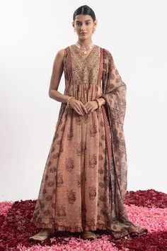 Peach anarkali with golden beads embroidered bodice, elevated with floral prints. Paired with a churidar and dupatta with floral prints - Aza Fashions Sleeveless Kurta With Zari Work For Reception, Sleeveless Salwar Kameez For Eid Reception, Semi-stitched Sleeveless Anarkali Set With Cutdana, Traditional Sleeveless Salwar Kameez For Reception, Unstitched Sleeveless Salwar Kameez With Sheer Dupatta, Semi-stitched Sleeveless Salwar Kameez With Sheer Dupatta, Traditional Sleeveless Anarkali Set With Cutdana, Sleeveless Anarkali Set With Zari Work For Navratri, Bollywood Style Sleeveless Kurta With Cutdana