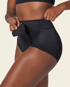 This classic postpartum girdle comfortably compresses your mid-to-lower tummy. Its front panel is made of double-layered PowerSlim® fabric for firm compression. Adjustable Velcro sides allow you to find your perfect fit and choose your own compression level. The stretchy waistband and leg bands are covered for a comfortable fit without panty lines. With no hooks or zippers, this is the ideal panty to wear as you get back into shape, while protecting your c-section incision or recovering from a n Compressive Full Coverage Shapewear With Built-in Padding, Compressive Full Coverage Shapewear For Workout, Full Coverage Shapewear With Built-in Padding, Compressive Supportive Shapewear, Supportive Shapewear Bottoms With Wide Waistband, Compressive Black Bottoms With Built-in Padding, Compression Nylon Full Coverage Shapewear, Nylon Compression Shapewear With Full Coverage, Supportive High Waist Shapewear With Wide Waistband