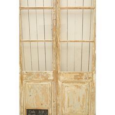 an old wooden door with two glass panels