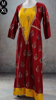 **Product color may have slight variations due to surrounding light** PRODUCT DETAILS This is a very beautiful maroon and yellow ethnic dress with gold print and Indian print throughout its body. It has gota patti detailing near its yoke and sleeves. It has three-quarter sleeves, and asymmetric hem. The Kurti has a slightly wider neck. It can be worn with a leggings or as a dress. Size & Fit Medium Chest: 38 inches Waist: 36 inches Back Shoulder: 15 inches Sleeve Length: 17 inches Armhole Round: Fitted Yellow Palazzo Set With Printed Motifs, Fitted Cotton Silk Palazzo Set With Long Sleeves, Fitted Long Sleeve Cotton Silk Palazzo Set, Designer Red Cotton Silk Dress, Red Cotton Silk Dress With Dupatta, Festive Cotton Silk Maxi Kurta, Festive Cotton Silk Maxi Length Kurta, Wedding Dresses With Kalamkari Print, Anarkali Tunic Designer Dress