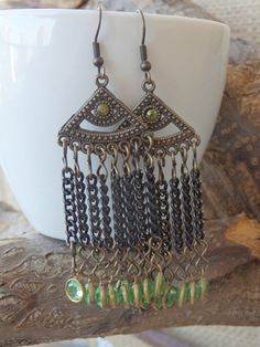 Chandelier green earrings. Green dangle earrings. Bohemian Fringes earrings. Crystal dangle chain earrings. Boho fringe earrings These green chandelier earrings are comfortable and unique, that will fit many styles and will be a perfect boho style gift for women. Metal: Brass, Oxidized Silver Gemstone: Length: 6 cm (2.36 inches) Width: 2.5 cm (0.98 inches) The earrings will be packed in a gift box. FOR MY EARRINGS COLLECTION HERE: https://www.etsy.com/il-en/shop/rebekajewelry?section_id=14222612 Green Dangle Chandelier Earrings, Green Metal Chandelier Earrings, Green Dangling Bead Chandelier Earrings, Metal Tassel Earrings With Dangling Beads, Wire Wrapped Metal Chandelier Earrings, Green Bohemian Chandelier Earrings With Dangling Beads, Green Bohemian Metal Chandelier Earrings, Green Bohemian Chandelier Earrings, Green Metal Bohemian Chandelier Earrings