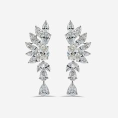 Whenever I visit Amsterdam, the first place I go to is the beautiful and timeless flower markets. I am immediately calmed by the striking display of flowers, bountiful and bursting with life. This is the feeling that I wanted to capture in the design of the Amsterdam Earrings. Delicately crafted with a combination of marquise, oval, and pear diamonds the diamond petals create a stunning structured edge, highlighting the grace and beauty only the Amsterdam Earrings can capture. Luxury White Gold Earrings With Intricate Design, Luxury Exquisite Diamond White Chandelier Earrings, Luxury Diamond Accents Flower Earrings, Luxury Silver Marquise Diamond Earrings, Luxury Diamond Flower-shaped Bridal Earrings, Luxury Diamond Flower-shaped Earrings, Exquisite Diamond Flower-shaped Earrings, Diamond Outline, Visit Amsterdam