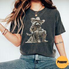 "Vintage Cowboy Racoon Shirt | Funny Western Trash Panda Tshirt | Retro 90s Graphic Tee | Weirdcore Meme Clothing | Oversized Shirt Matching Sweatshirt: https://printworkshopcompany.etsy.com/listing/1710066867/vintage-cowboy-racoon-sweatshirt-funny ** HOW TO ORDER 1. Check our photos for sizing and color options.  2. Select your size and color from the drop-down menus.  3. Click \"ADD TO CART\" to add the shirt to your cart. 4. Click \"PROCEED TO CHECKOUT\" to purchase your shirt. ** VIP Email L Grunge Style Shirt With Funny Print And Relaxed Fit, Acid Wash Short Sleeve Top With Funny Print, Grunge Relaxed Fit Top With Sublimation Print, Acid Wash Grunge Tops With Sublimation Print, Relaxed Fit Acid Wash Tops With Funny Print, Distressed Crew Neck Grunge Shirt, Acid Wash Graphic Tee With Funny Print, Vintage Acid Wash Tops With Sublimation Print, Vintage Acid Wash Top With Sublimation Print