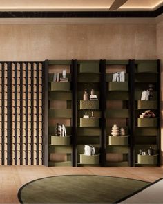 a living room filled with furniture next to a wall covered in bookshelves and shelves