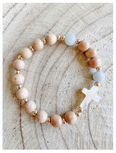 Need reminders to pray the Rosary? The Rosary Bracelet with Mother of Pearl Cross is the perfect daily wear piece to add to your Catholic jewelry collection. Handmade using rosewood and aquamarine beads, it is eye-catchingly beautiful. Rosewood and aquamarine beads Mother of Pearl Cross Stretch bracelet fits most Includes "How To Use Your Rosary Bracelet" card Made in the USA Rosary Bracelet The Catholic Company, Catholic Rosary Bracelet The Catholic Company, Rosary Bracelet Diy, Catholic Rosary Bracelet, Pray The Rosary, Catholic Bracelet, Bracelet Card, Rosary Jewelry, Communion Decorations