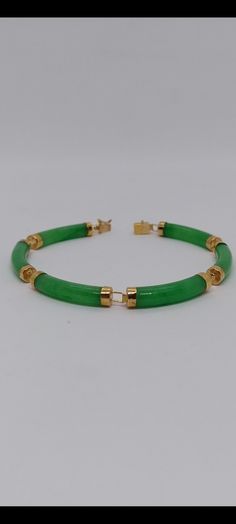 14K Yellow Gold Green Jade Curved Link Bracelet. Six Green Jade link section Curved Jade Bracelet in 14k yellow gold for her and for him. Bracelet Info: - Gemstone: Green jade, - Bracelet length: 7 Inches / Bracelet width: 5 Millimeters - Materials: Yellow Gold - Finished: 14k - Nice gift box Included. Green Bangle Bracelet For Formal Occasions, Green Bangle Bracelets For Formal Occasions, Classic Jade Bracelets For Formal Occasions, Formal Green Bangle Bracelets, Green Jubilee Gold Bracelet For Formal Occasions, Formal Green Gold Jubilee Bracelet, Formal Green Bracelets With 17 Jewels, Formal Yellow Gold Jade Bracelets, Formal Yellow Gold Jade Bracelet