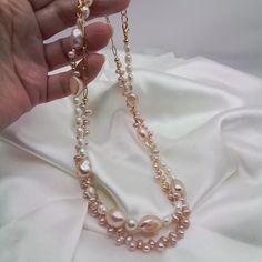 Two Pretty baby pink pearl necklaces. Both are sold together for the price of $50.00  one necklace has large pink baroque pearls and white rice pearls mixed Intermittently.  The other has small dainty pink baroque baby pearls .A lovely mix of quality natural freshwater pearls. A beautiful gift for your wife girlfriend sweetheart or just a new addition to your jewelry box.   These necklaces will be a staple for your feminine outfits.  Ready to dispatch to you in one business day..my handmade items are one of a kind....special and distinctive.   Thanks for visiting my shop GemsbyZoey... Handmade Baroque Pearl Necklace As Gift, Pink Beaded Pearl Chain Necklace As A Gift, Handmade Long Pearl Necklace, Pink Beaded Necklace With Pearl Chain As Gift, Pink Beaded Necklaces With Pearl Chain As A Gift, Pink Pearl Drop Beaded Necklaces With Round Beads, Pink Pearl Jewelry With Pearl Chain, Handmade Pearl White Baroque Pearl Necklace, Pink Necklace With Pearl Pendant For Jewelry Making