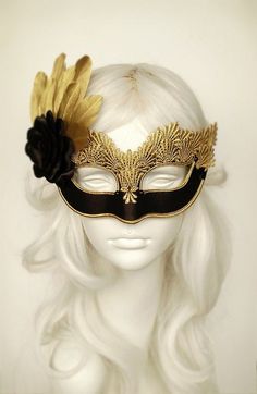 Venetian style black and gold masquerade ball mask covered with black satin. Embellished with gold lace, braided trim, black beads, black satin rose and gold feathers. Your order will be delivered with online tracking by DHL or UPS. Back surface is also covered with fabric for comfortable Gothic Gold Costume Accessories For Masquerade, Gold Gothic Costume Accessories For Costume Party, Gothic Gold Costume Accessories For Costume Party, Gothic Gold Masks And Prosthetics For Costume, Gold Mardi Gras Costume Accessories, Mardi Gras Costume Accessories In Gold, Gold Venetian Mask For Halloween, Black Masquerade Mask For Halloween Wedding, Gold Gothic Masquerade Mask For Carnival