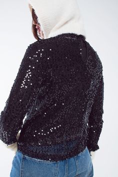 Introducing our Long Sleeve Glitter Top in Black, a dazzling and versatile party piece that's sure to make you shine at festive gatherings, especially during Christmas and New Year's Eve. This black glitter top is designed to add a touch of glamour and style to your wardrobe, and here's why it's a must-have:  This amazing party top is adorned with a multitude of glitters, ensuring you'll be the center of attention wherever you go. With long sleeves, it's the perfect choice for celebrating special occasions during the holiday season, adding an extra layer of elegance and warmth to your outfit.  The slim fit of this top not only enhances your silhouette but also adds a touch of sophistication to your look. The embroidered detail and sequins on this top make it a standout piece that's perfect Black Glitter Top, Long Sleeve Sequin Top, Glitter Top, Long Sleeve Sequin, Style Party, Party Tops, Sequin Top, Black Glitter, Party Looks