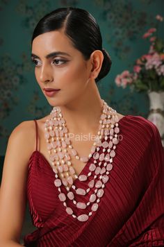 The pink stone necklace with shell pearls is flawlessly handcrafted by the artisans of India to celebrate beauty with the heritage of rich old Indian Jewelry. The five-layered stone necklace is designed to give you a breezy color therapy. Add a punch of soft colors to your style and watch the heads turn. Make your mark and pair this statement long necklace with your festive or contemporary ensembles. Necklace Closure - Lobster Hook Style Tip - This design is a perfect intersection of bohemian an Traditional Pink Gemstone Beads Necklaces, Traditional Pink Necklace With Gemstone Beads, Traditional Pink Gemstone Beads Necklace, Traditional Pink Necklace For Gift, Traditional Pink Necklaces For Gifts, Traditional Pink Gemstone Bead Necklace, Traditional Pink Necklaces With Gemstone Beads, Exquisite Pink Gemstone Necklaces, Exquisite Pink Gemstone Necklace