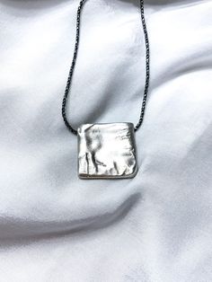 "Ashley - Handmade Square locket pendant This one-of-a-kind pendant was created using the lost wax casting technique. It was first handcrafted from wax and then cast in silver, resulting in a truly unique piece. Designed to bring a fresh and stylish touch to both everyday wear and special occasions, this pendant embodies perfection in silver, adding a touch of elegance to any necklace. ✤ DETAILS ✤ * Material: 925 Silver * 100% Hypoallergenic & Tarnish Resistant, no green skin! ✤ HOW TO ORDER ✤ *Choose your desired length from the dropdown menu, then click \"\"Add to Cart\"\" and proceed to checkout. ➢ MORE NECKLACE: https://www.etsy.com/shop/NiahJewelryDesign?ref=shop-header-name&listing_id=1361449260&section_id=37996777 ➢ BACK TO MY SHOP: https://www.etsy.com/il-en/shop/NiahJewelryDesign Minimalist Handmade Necklace For Keepsake, Artisan Necklace With Rectangular Pendant As A Gift, Oxidized Pendant Necklace For Gift, Hand Cast Round Pendant Jewelry For Gift, Artisan Rectangular Pendant Necklace As A Gift, Hand-cast Round Pendant Jewelry Gift, Artisan Style Rectangular Pendant Necklace As Gift, Oxidized Finish Pendant Necklace For Gift, Handmade Amulet Necklace For Everyday Wear