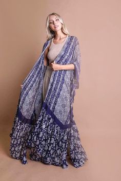 Wear these as a cover up or lower clothing item. Come in flowy paisleys and swirly designs to keep you cool all summer long!Immediate ShippingSize : 57" x 24"24" Arm Hole Style: Kimono Print / Pattern: Paisley Fit: Oversized Sleeve: Mid Sleeve Length: Maxi Made In: ChinaFabric Contents: 100% ViscoseNon-stretch fabricSize Measurement (inch):Default: (Bust), (Waist), (Hips), 57.0 (Length) Swirly Designs, Paisley, Cover Up, Tapestry, Purple