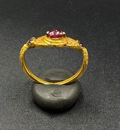 The Beautiful Antique Gold Ring Probably From South East Regions. Beautiful Garnet Gems Stone Is Place In The Ring. Size Details Pictures Are Listed Above. The Size Of This Ring Is USA 12. The Weight Is 4.34 Grams. 18 karat Gold .Test Certificate Available On Request Of Customer. Free And Fast Shipping World Wide. Antique 22k Gold Wedding Ring, Traditional Oval Ring With 17 Jewels, Gold Ruby Rings With Intricate Design, Antique 22k Gold Ceremonial Rings, Antique 22k Gold Rings For Ceremonial Occasions, 22k Gold Antique Rings For Ceremonial Occasions, Traditional Ruby Ring In Yellow Gold, Traditional Multi-stone Oval Rings, Traditional Oval Multi-stone Rings