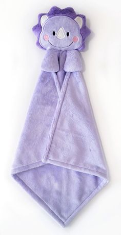 a purple towel with a teddy bear on it