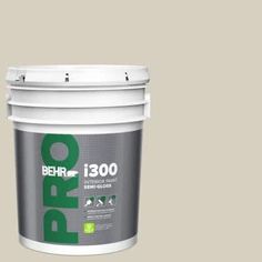 a bucket of behr paint with the words behr in green and white on it