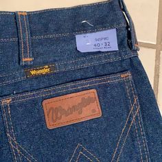 From My Collection, New Without Tags. Wrangler 945pwo Style, Regular Fit, Rinsed Rigid Raw Indigo Denim, Cowboy Cut, Tag 40x32. Measured Laying Flat: Waste 19 Inches (38), Inseam 31.5, Front Rise 13, Hem Opening 9.5. Zipper Scovill. Vintage Dark Wash Jeans For Rodeo, Vintage Denim Jeans For Rodeo, Vintage Medium Wash Bottoms For Rodeo, Vintage Dark Wash Bottoms For Rodeo, Vintage Jeans For Rodeo With Pockets, Retro Cotton Jeans For Rodeo, Vintage Cotton Jeans For Rodeo, Vintage Cotton Bottoms For Rodeo, Denim Cowboy