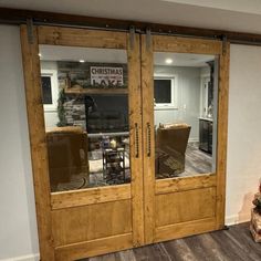 two chairs are sitting in front of the sliding glass doors that lead into the living room