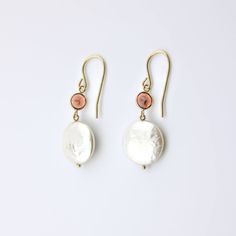 These 14 karat solid yellow gold earrings are pretty. They include coin pearl and Round Garnet Gemstones. These beautiful dangle earrings will make an excellent gift for yourself or a loved one on any occasion. Coin Pearl Size: 13 mm Garnet Size: 5 mm 14k Yellow Gold Filled Round Pearl Earrings, 14k Gold Jewelry With Pearl Drop For Anniversary, 14k Gold Pearl Drop Jewelry For Anniversary, 14k Gold Jewelry With White Pearl Drop, 14k White Gold Filled Round Jewelry, Yellow Gold 14k Gold-filled Jewelry With Matching Earrings, 14k Gold White Pearl Drop Jewelry, Gold-plated Briolette Jewelry In Gold, Oval 14k Gold-filled Jewelry For Anniversary