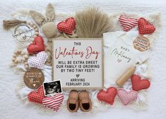 a valentine's day card surrounded by hearts and other items on a white blanket