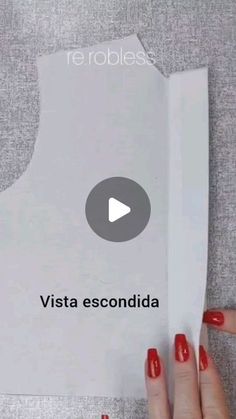 a woman holding up a piece of paper with the words vista escondida on it