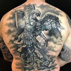 a man with a tattoo on his back