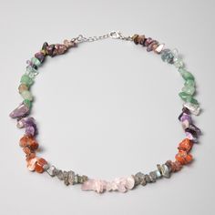 "Chakra Stones  Necklace Details: Gemstones: Amethyst, Iolite, Lapis Lazuli, Green Aventurine, Jade,Yellow Aventurine,Jasper Gemstone type: Irregular chips Total length: 40cm/16\"+extends to 45cm/18\" ... Check out the full catalogue of beaded necklaces here: https://www.etsy.com/shop/PaleoGemsJewellery?section_id=40958762 🔹Please note While you're checking out the photos, remember that each gemstone is like a fingerprint - totally unique. Colors and shapes play differently in each piece, making them one-of-a-kind. Our pics are snapped under some bold lights to highlight their beauty, but your actual piece might have its own little variations. 🔹Caring for gemstones Wait for your body lotions and perfumes to set in before you put on your jewelry. Ensure your jewelry is stored in a dry env Chip Bead Necklace, Gemstone Choker Necklace, Aventurine Necklace, Gemstone Choker, Chakra Necklace, Natural Gemstone Jewelry, Chip Beads, Chakra Crystals, Jasper Gemstone