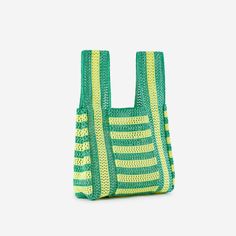 Meet your new beach bag. Statement-making t-shirt bag made from repurposed deadstock raffia and yarn. Striped body and handles. Sturdy crochet-style knit construction. Details Body: 100% ViscoseHand wash cold, dry flat12.5"W, 21.5"L, 9" strap drop Summer Handwoven Crochet Bag Made Of Yarn, Handwoven Green Crochet Beach Bag, Green Crochet Straw Tote Bag, Green Woven Crochet Bag For Beach Season, Green Crochet Tote Straw Bag, Green Casual Crochet Beach Bag, Casual Green Crochet Beach Bag, Green Woven Crochet Bag For Shopping, Green Crochet Bag For Beach Shopping