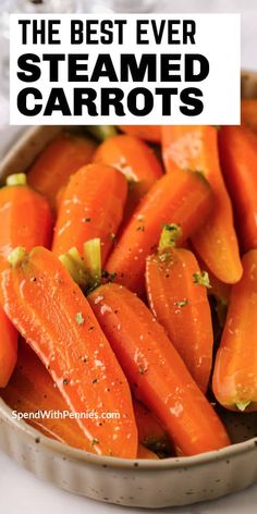 a bowl filled with cooked carrots on top of a table