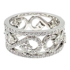 About This Piece: The Tiffany & Co Platinum Diamond Eternal Enchant Wide Band Ring is a testament to exquisite craftsmanship. Designed in size 6, its platinum band is adorned with an intricate array of shimmering diamonds, woven seamlessly into a captivating pattern. This piece epitomizes luxury, elegance, and timeless sophistication. Metal: Platinum  Ring Size: 6  Weight: 10.6 grams Width: 9mm  Stones: 218 Round Brilliant Cut Diamond VS1 clarity, G color, Total weight Approx 1.70ctw  Hallmarks: Luxury Diamond Ring With Decorative Band, Diamond Eternity Band With Decorative Details For Anniversary, Anniversary Diamond Ring In White Gold With Decorative Band, Anniversary Diamond Eternity Band With Decorative Details, Luxury Diamond Accents Promise Ring Bands, Luxury Diamond Cut Bands Made Of Diamond, Luxury Silver Rings With Decorative Band, Silver Diamond Eternity Band With Pave Setting, White Gold Diamond Ring With Decorative Band For Promise