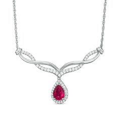 Classic and sophisticated, this fashion necklace flows with easy elegance. Crafted in sterling silver, this exquisite style shimmers with an 8.0 x 5.0mm pear-shaped lab-created bright red ruby dangle framed with sparkling petite lab-created white sapphires - all beneath an attractive chevron-shaped twist of polished and created sapphire-lined ribbons. Buffed to a brilliant luster, this design suspends centered along an 18.0-inch rope chain that secures with a spring-ring clasp. Elegant Gemstone Drop Necklace For Anniversary, Elegant Teardrop Drop Necklace For Formal Occasions, Elegant Pear-shaped Drop Necklace With Diamond Accents, Elegant Pear-shaped Gemstone Diamond Necklace, Elegant Teardrop Drop Necklace For Anniversary, Formal Teardrop Diamond Necklace With Gemstone, Formal Teardrop Gemstone Diamond Necklace, Formal Teardrop Gemstone Pendant Necklace, Elegant Pear-shaped Necklace With Diamond Accents