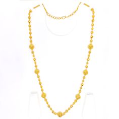 This handmade chain is a celebration of craftsmanship and tradition, made from 22k yellow gold that adds a warm, radiant glow to any attire. Weighing 60.0 grams, it boasts a substantial presence, signifying its high quality and durability. The chain extends over a length of 30 inches, adorned with beads that reach up to 13.25 mm in width, providing a striking visual impact. It features 1.7 inches of adjustable links, offering versatility and a personalized fit, complemented by a secure hook lock